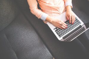 Woman typing on laptop